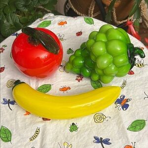 vintage art glass fruit. Red apple, green grapes, and a yellow banana.